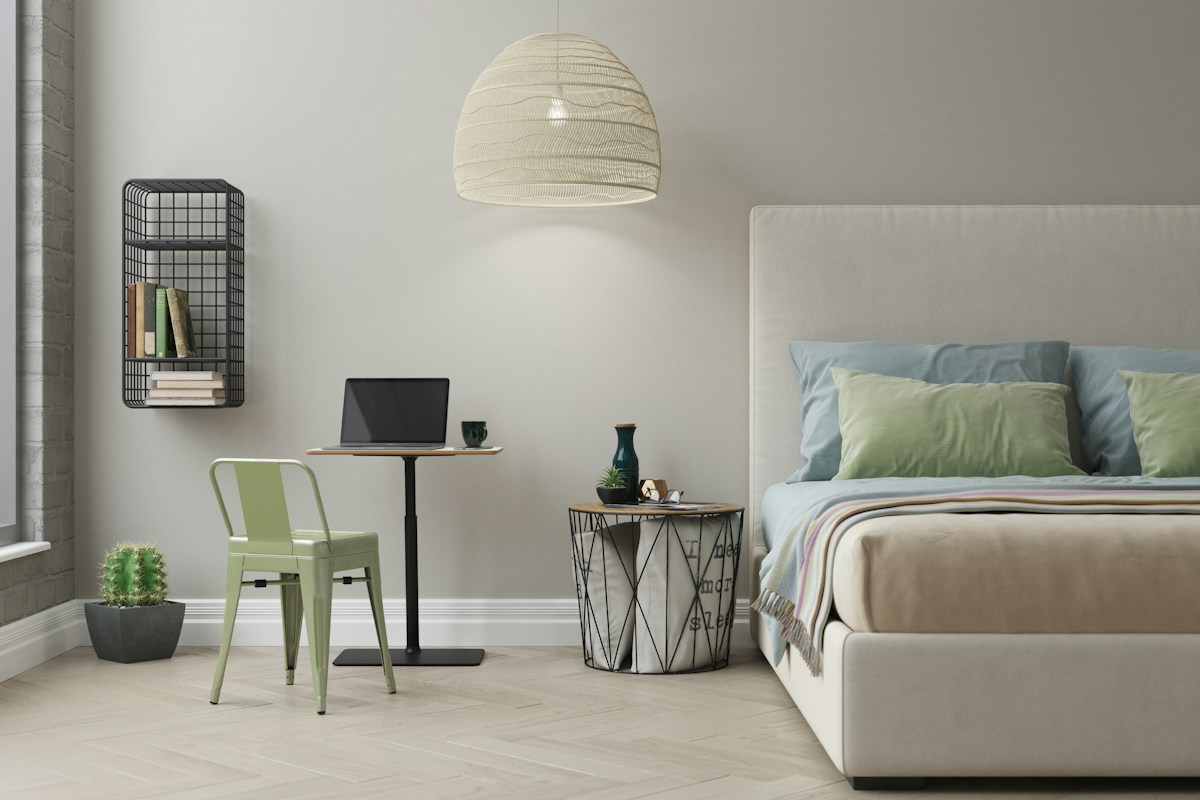 A white table lamp on a desk
